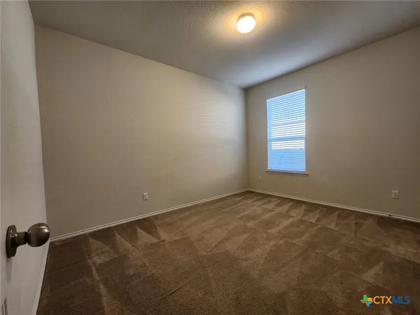 en empty room with windows