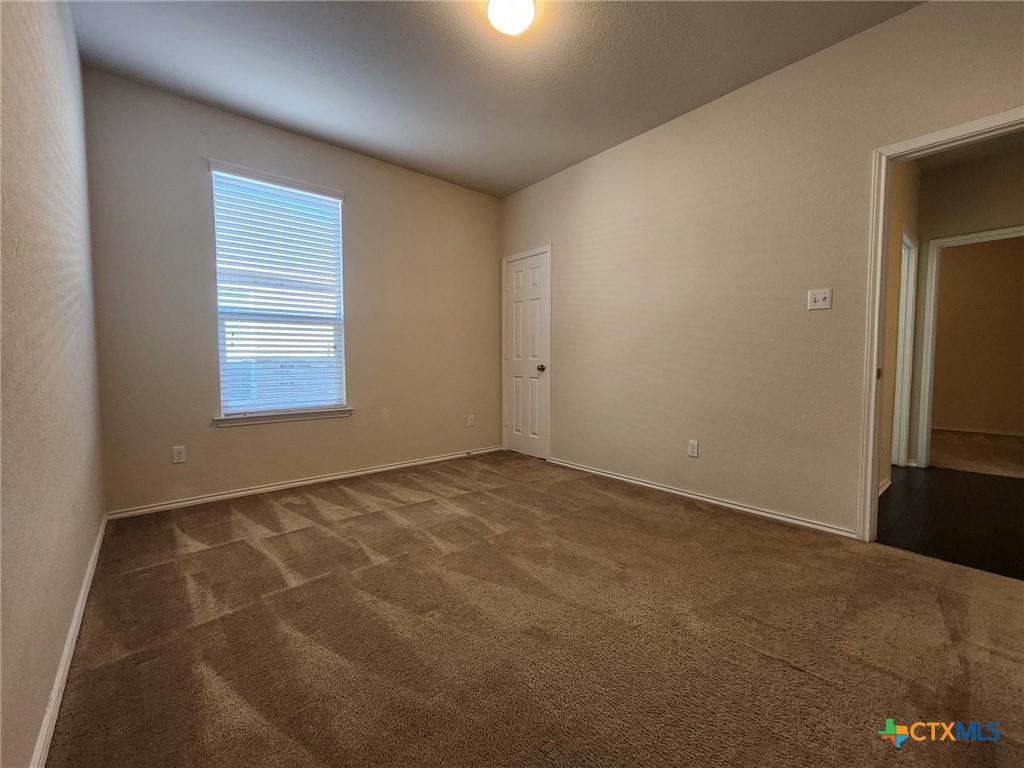 5822 Hopkins Drive Temple, TX 76502 - Photo 8 of 32 en empty room with windows