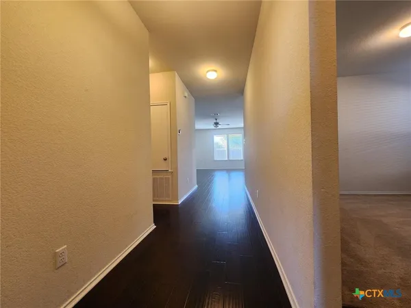 a view of a livingroom with wooden floor