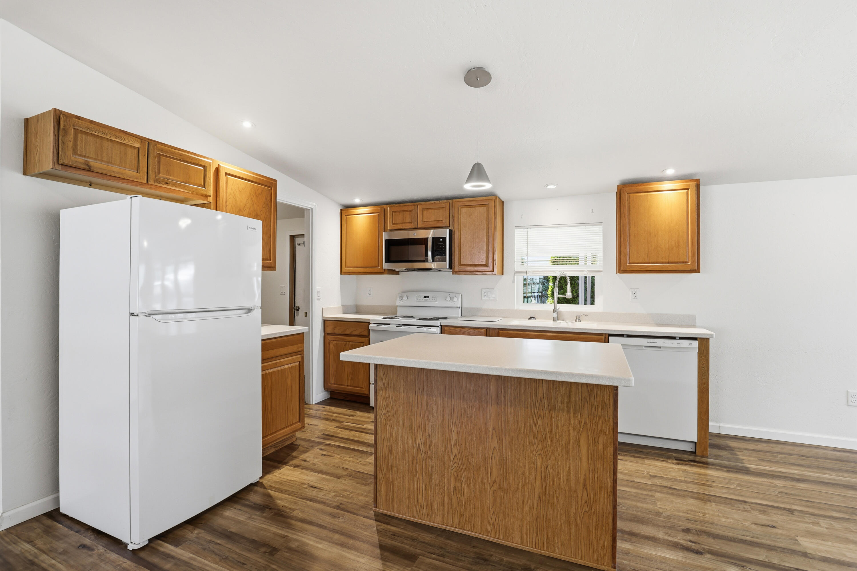 8401 Old Stage Road, Unit 16 Central Point, OR 97502 - Photo 8 of 23 a kitchen with cabinets and stainless steel appliances