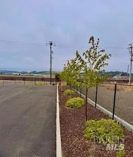 a view of a lake with a table and a chair