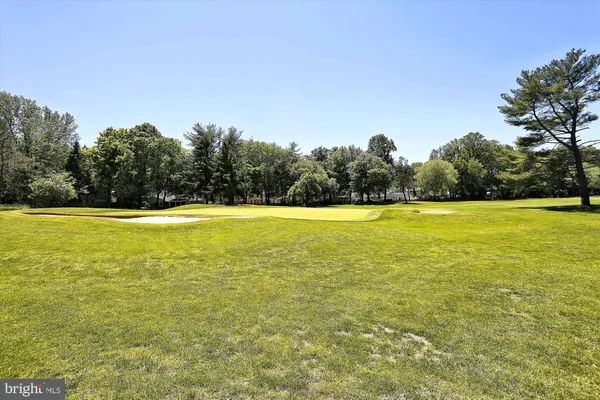 a view of a swimming pool and a yard