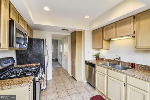 a view of a hallway with a wooden cabinets