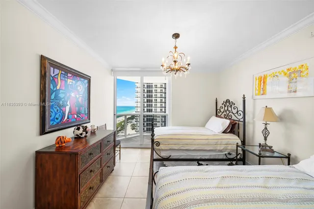 a bedroom with furniture and a chandelier