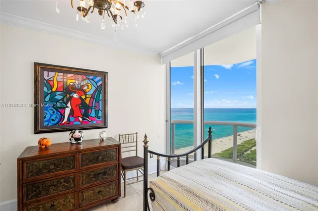 a bedroom with furniture and window