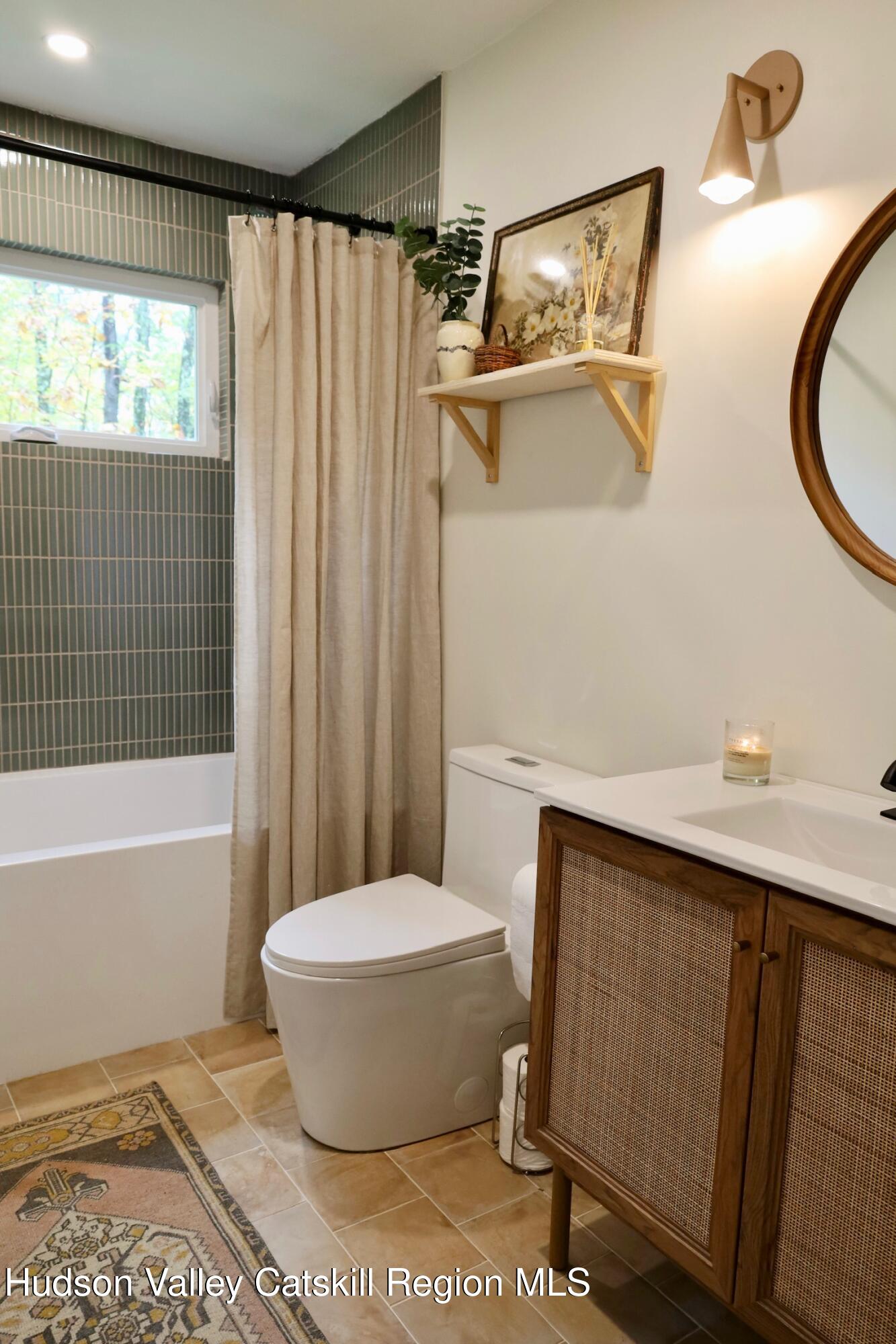 230 Potic Mountain Road Athens, NY 12414 - Photo 14 of 25 a bathroom with a sink and a mirror
