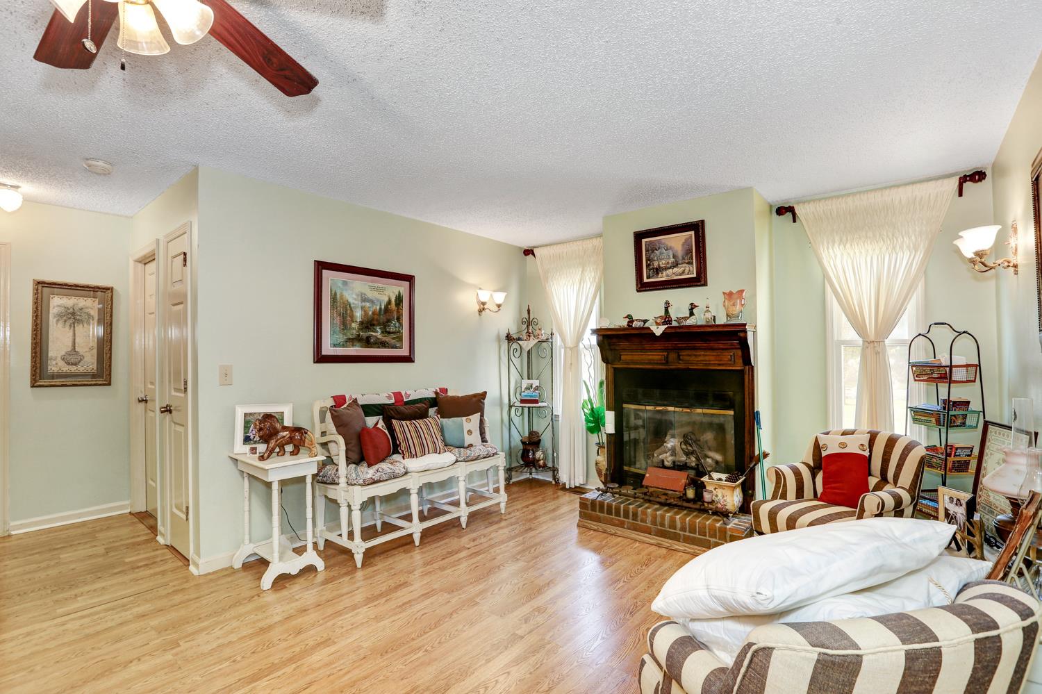 2345 Crescentview Road Pulaski, TN 38478 - Photo 3 of 23 a living room with furniture and a fireplace