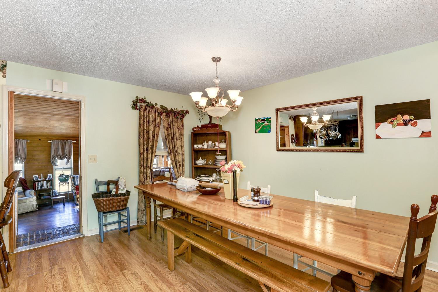 2345 Crescentview Road Pulaski, TN 38478 - Photo 4 of 23 a view of a dining room with furniture a chandelier and wooden floor