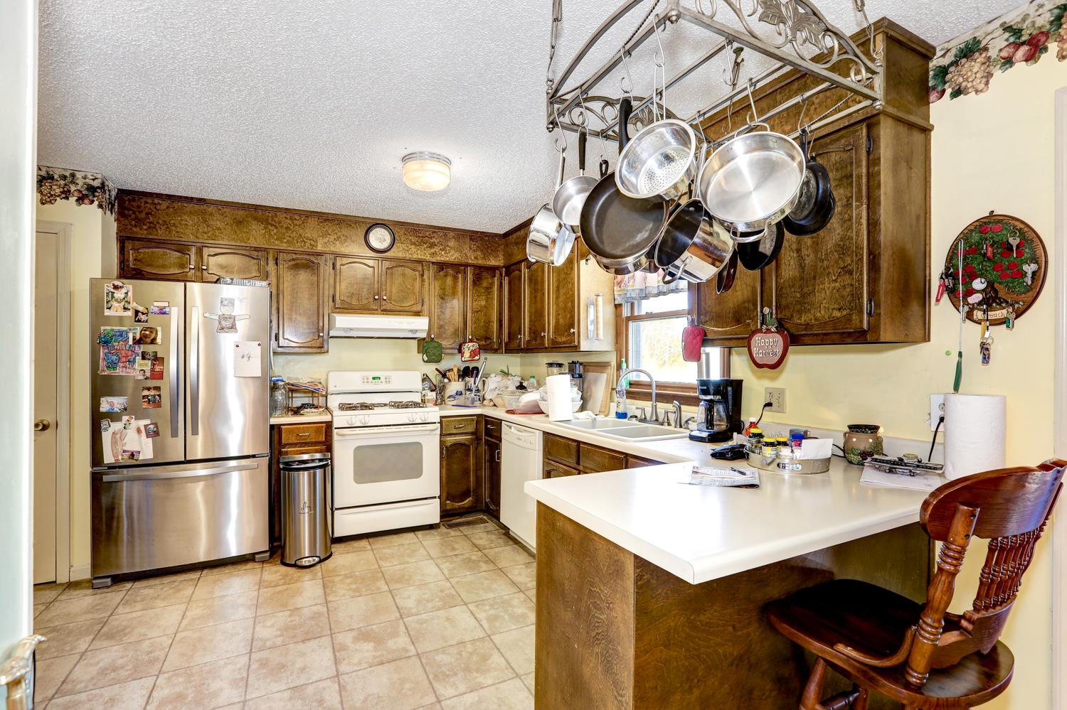 2345 Crescentview Road Pulaski, TN 38478 - Photo 5 of 23 a kitchen with a sink a stove and a refrigerator