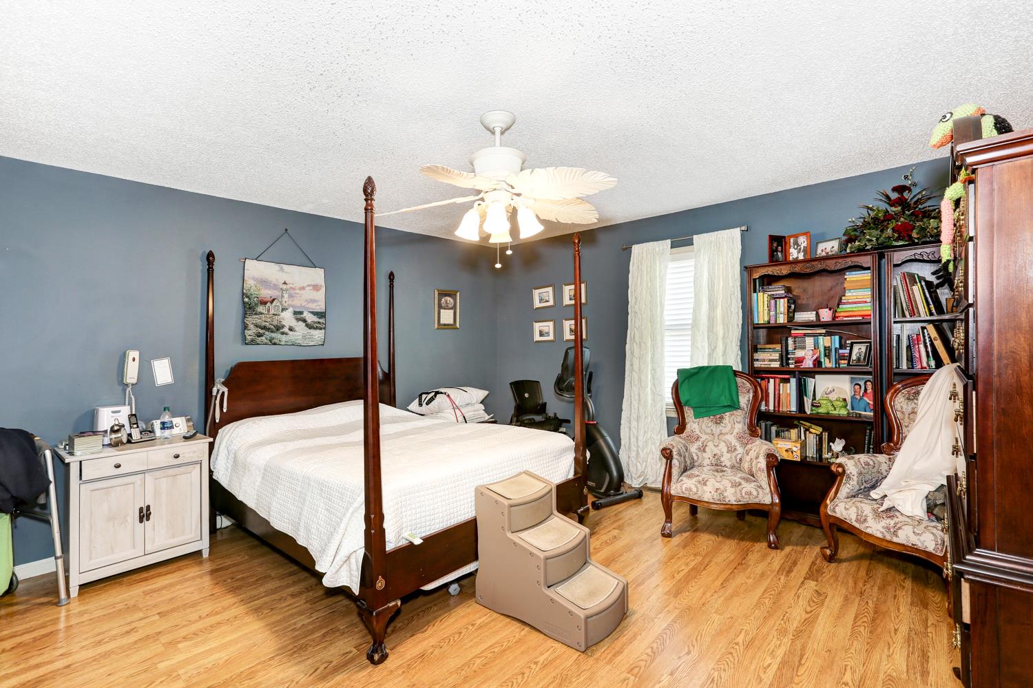 2345 Crescentview Road Pulaski, TN 38478 - Photo 10 of 23 a bedroom with a bed furniture and a chandelier