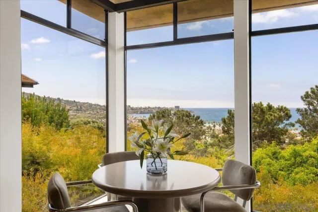 a view of a balcony with table and chairs