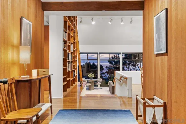 a view of living room with furniture and a fireplace