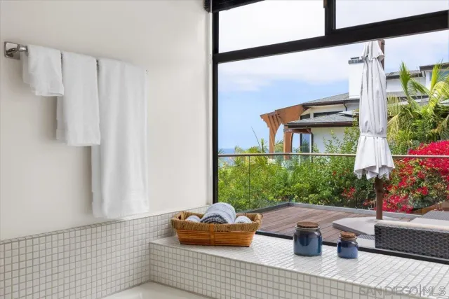 a view of a porch with chairs and couches