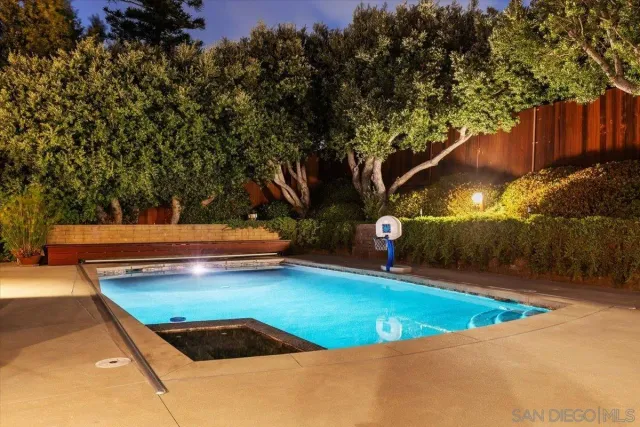 a view of a patio with swimming pool table and chairs