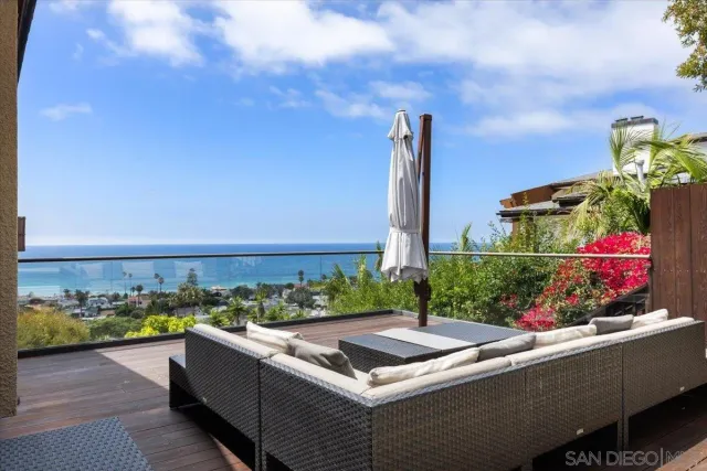an aerial view of residential houses with city view