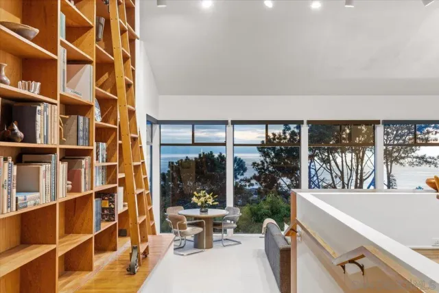 a view of a living room and a window and cabinet