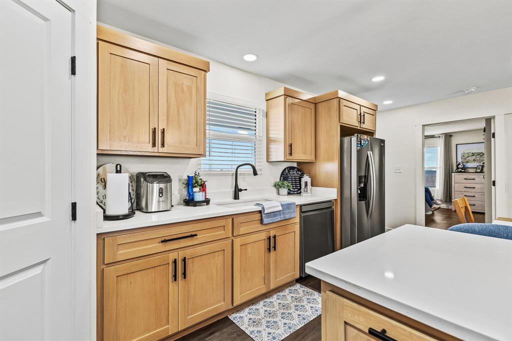 997 Private Road Brookston, TX 24977 - Photo 13 of 28 a kitchen with stainless steel appliances a refrigerator sink and cabinets