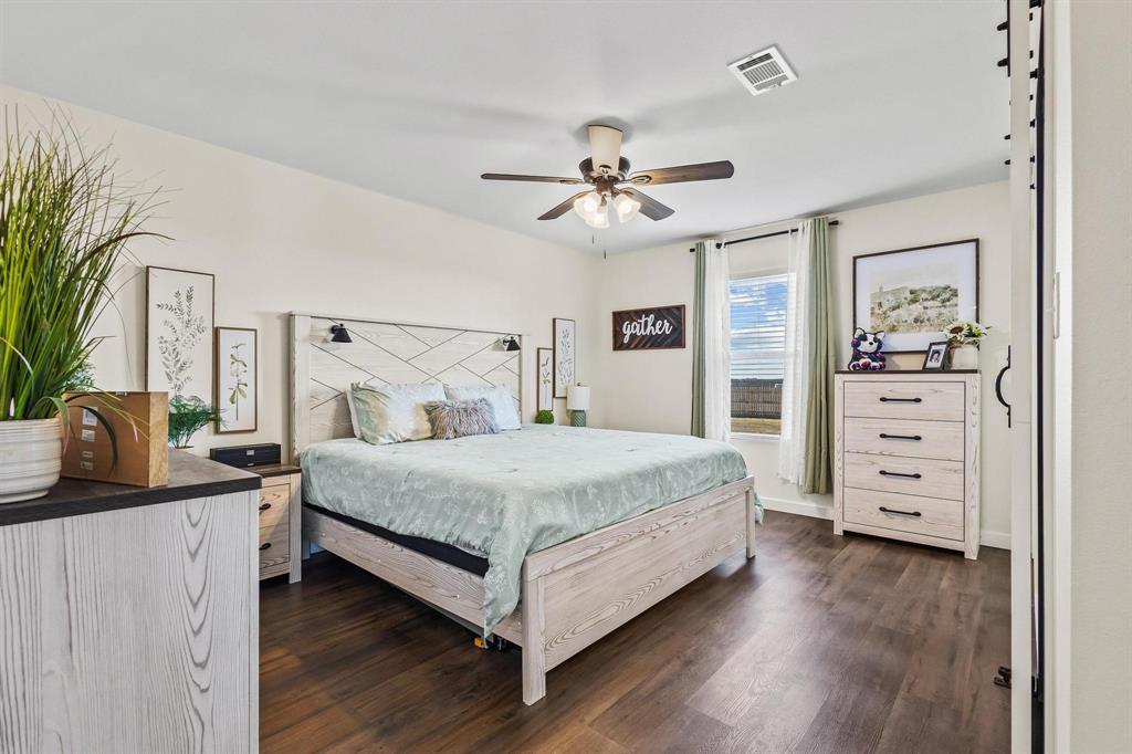 997 Private Road Brookston, TX 24977 - Photo 15 of 28 a bedroom with a bed and a dresser