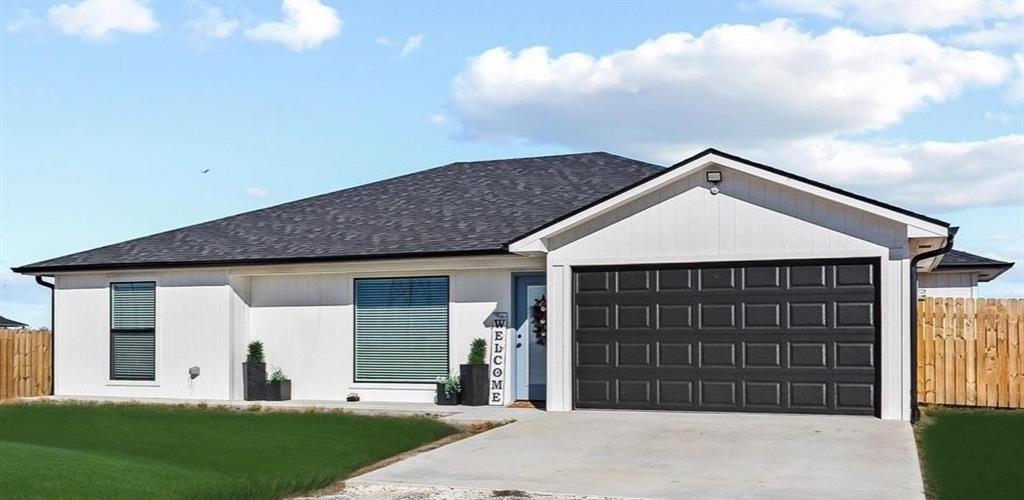 997 Private Road Brookston, TX 24977 - Photo 2 of 28 a front view of a house with a yard