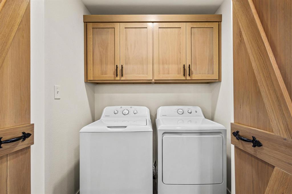 997 Private Road Brookston, TX 24977 - Photo 23 of 28 a utility room with dryer and washer