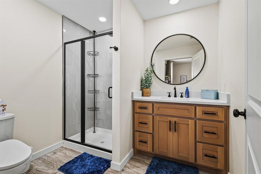 997 Private Road Brookston, TX 24977 - Photo 25 of 28 a bathroom with a sink a toilet and a mirror