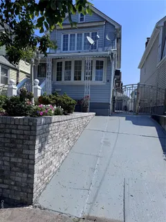 a front view of a house with yard