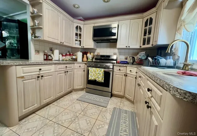 $849,990 | 93-53 207th Street | Bellaire West Ward