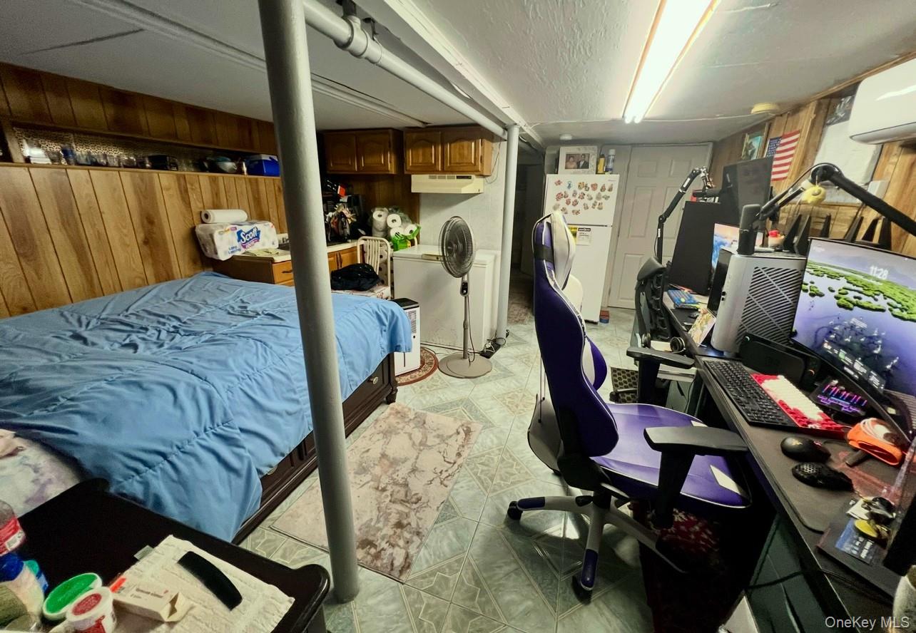 93-53 207th Street Queens, NY 11428 - Photo 25 of 36 a bedroom with furniture and a window