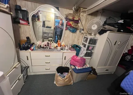 a bathroom with a mirror and vanity