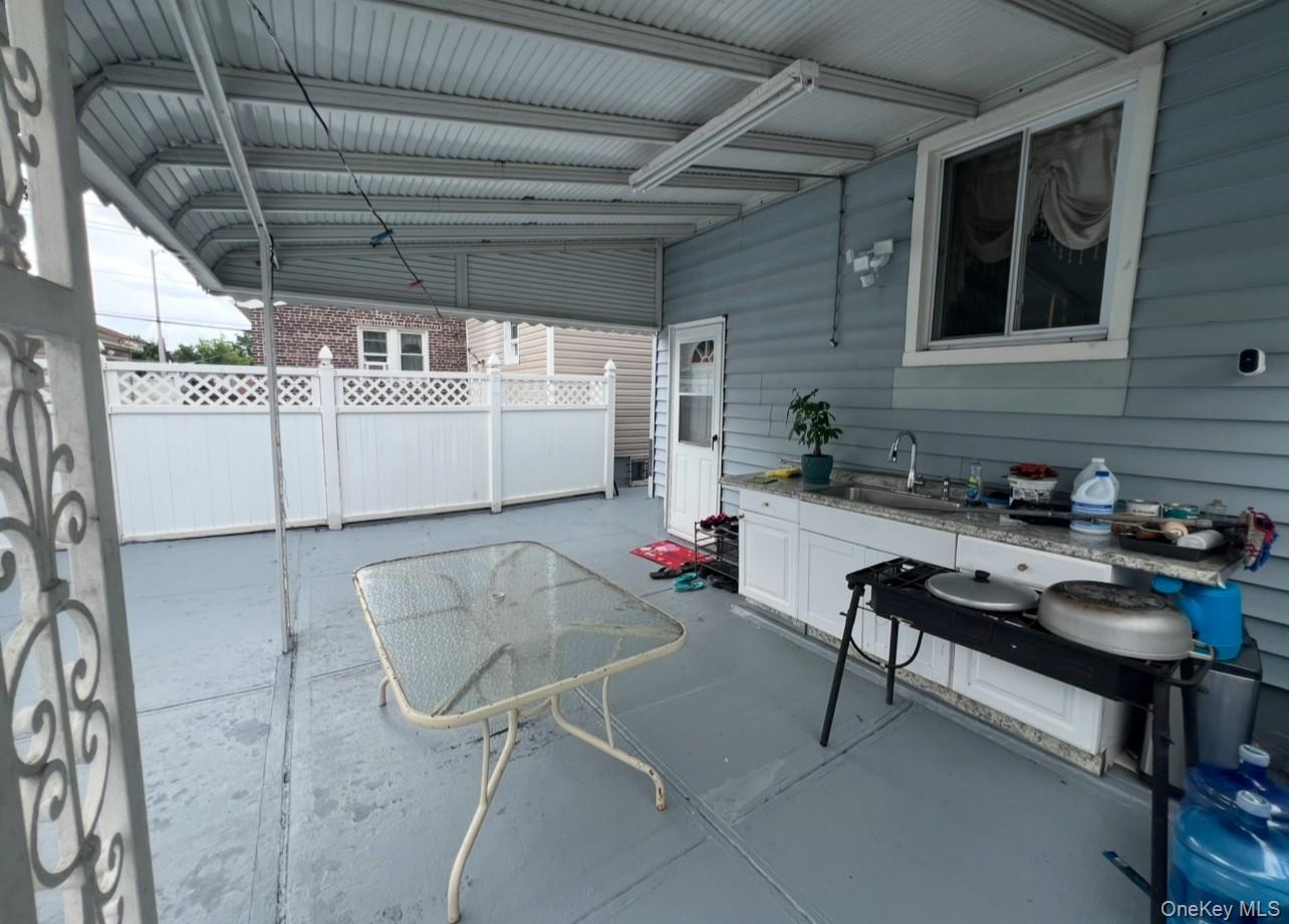 93-53 207th Street Queens, NY 11428 - Photo 9 of 36 a room with furniture