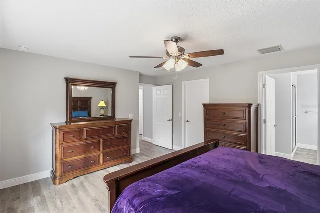 a bedroom with a bed and a dresser