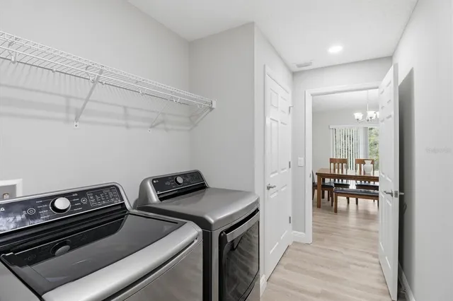 a view of room that has a ceiling fan and window