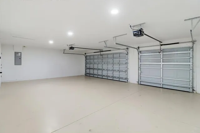 a view of hallway with a bathroom