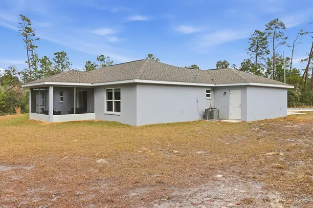 an aerial view of residential house with outdoor space