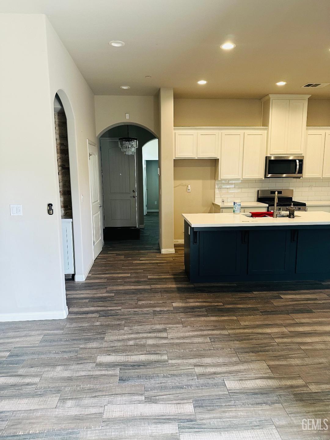 Undisclosed Address Bakersfield, CA 93314 - Photo 13 of 32 a kitchen with stainless steel appliances granite countertop a sink refrigerator and cabinets