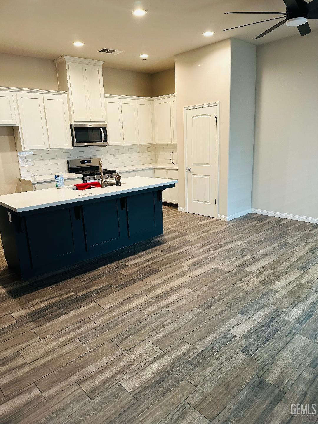 Undisclosed Address Bakersfield, CA 93314 - Photo 14 of 32 a kitchen with stainless steel appliances granite countertop a stove a sink and a refrigerator