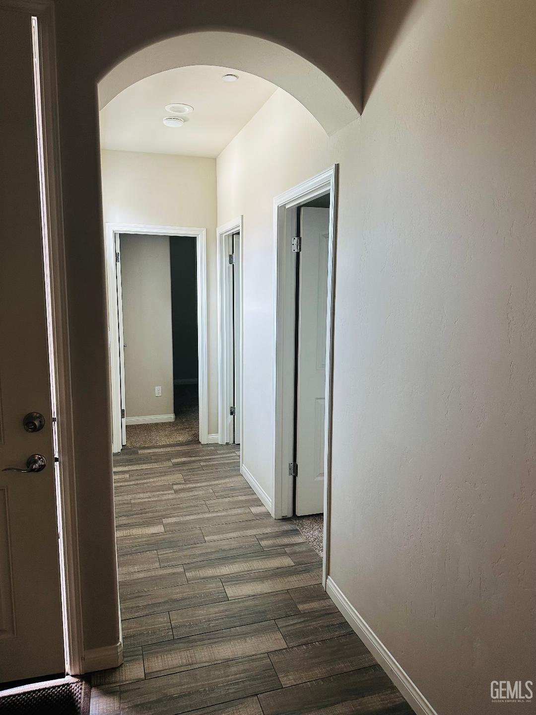 Undisclosed Address Bakersfield, CA 93314 - Photo 25 of 32 a view of a hallway with wooden floor