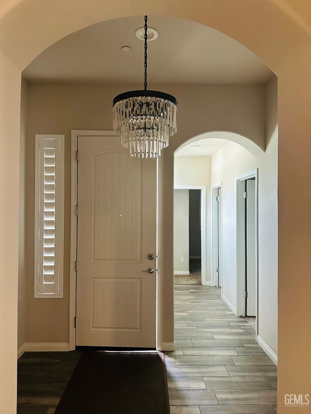 Undisclosed Address Bakersfield, CA 93314 - Photo 26 of 32 a view of hallway with chandelier and entryway