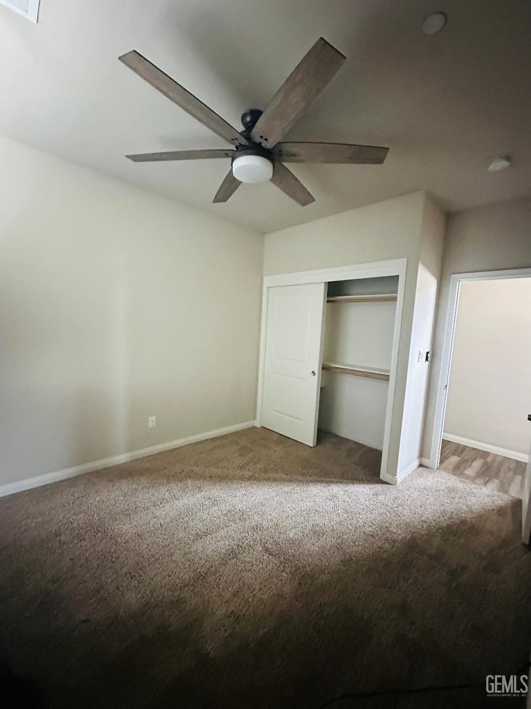 Undisclosed Address Bakersfield, CA 93314 - Photo 28 of 32 a view of empty room with a ceiling fan