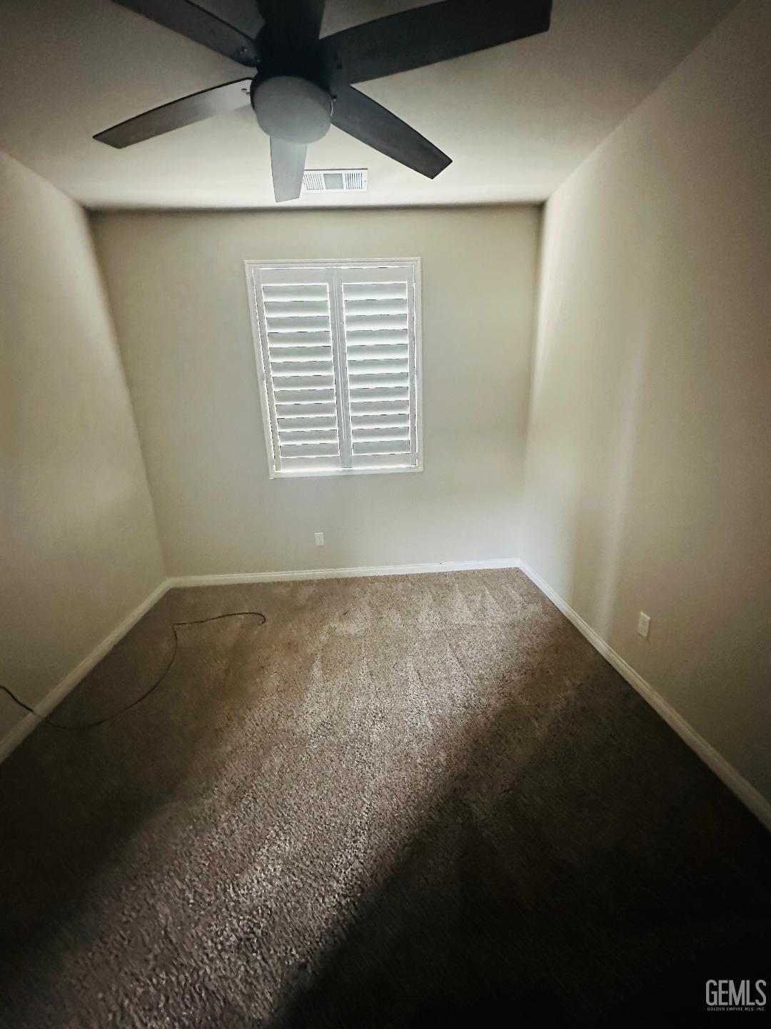 Undisclosed Address Bakersfield, CA 93314 - Photo 29 of 32 an empty room with wooden floor and windows