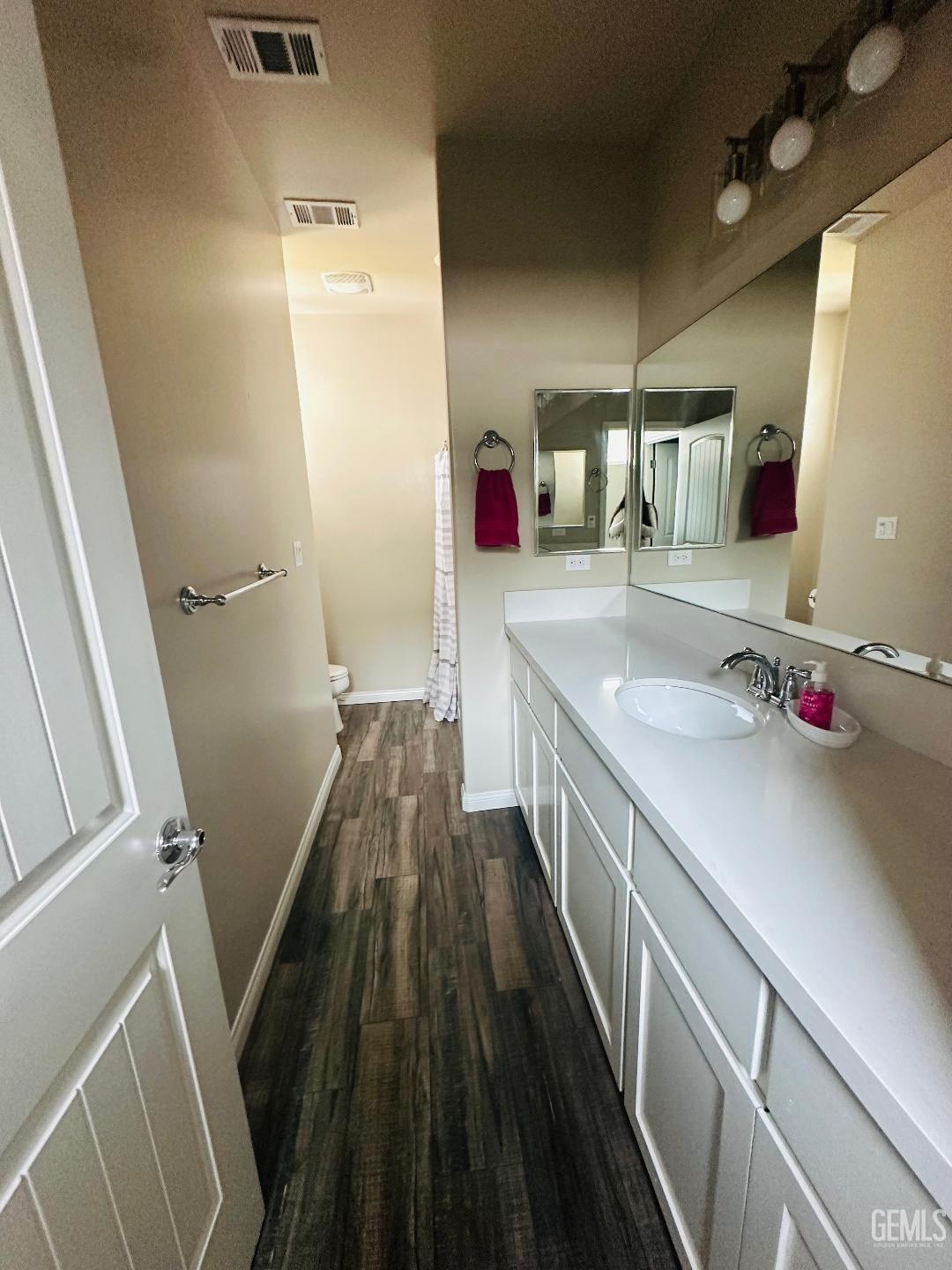 Undisclosed Address Bakersfield, CA 93314 - Photo 31 of 32 a bathroom with a sink and a mirror