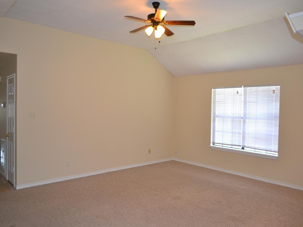 807 Welsh Avenue College Station, TX 77840 - Photo 2 of 11 an empty room with a window and a fan