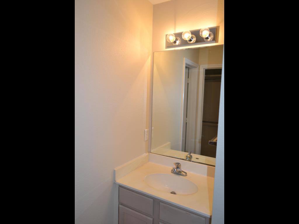 807 Welsh Avenue College Station, TX 77840 - Photo 8 of 11 a bathroom with a sink and mirror