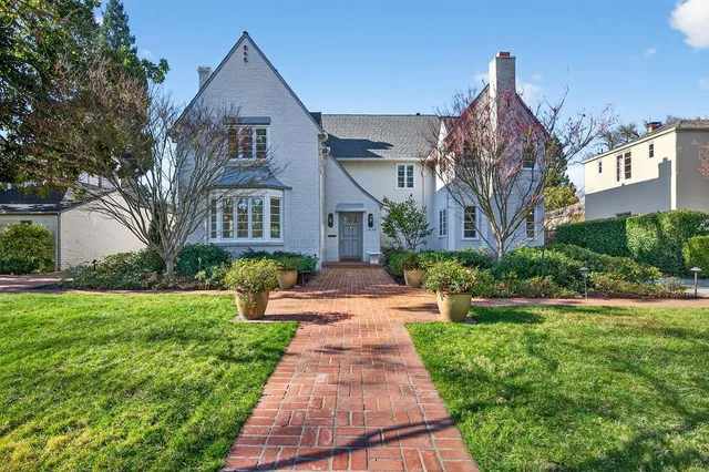 a front view of a building with a yard