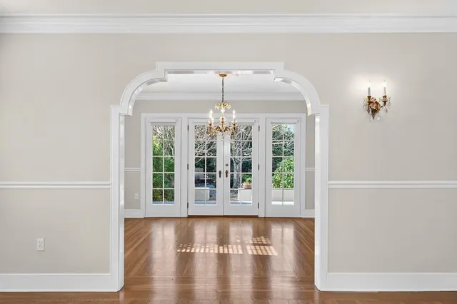 a view of a kitchen with wooden floor and a sink