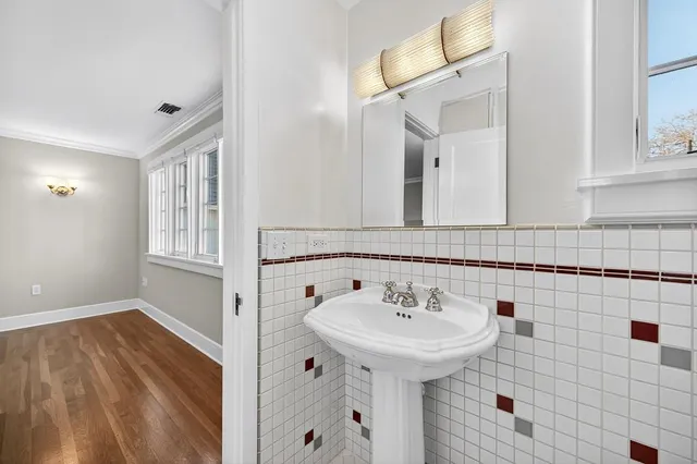 a kitchen with stainless steel appliances granite countertop a refrigerator a sink and a stove