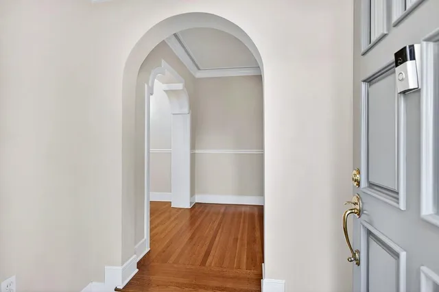 a view of entryway with wooden floor
