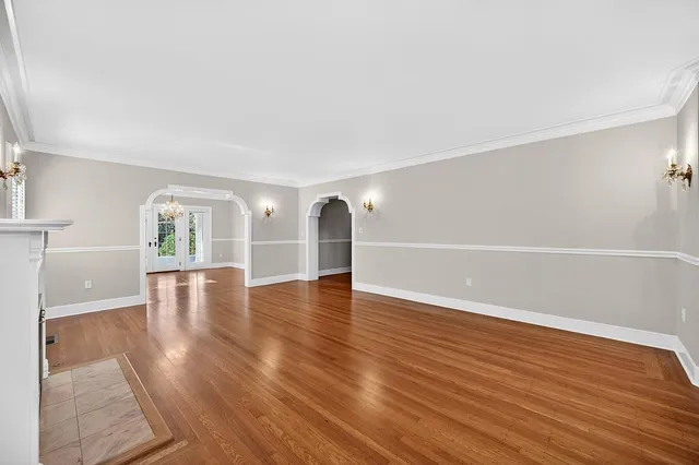 a kitchen with white cabinets and appliances