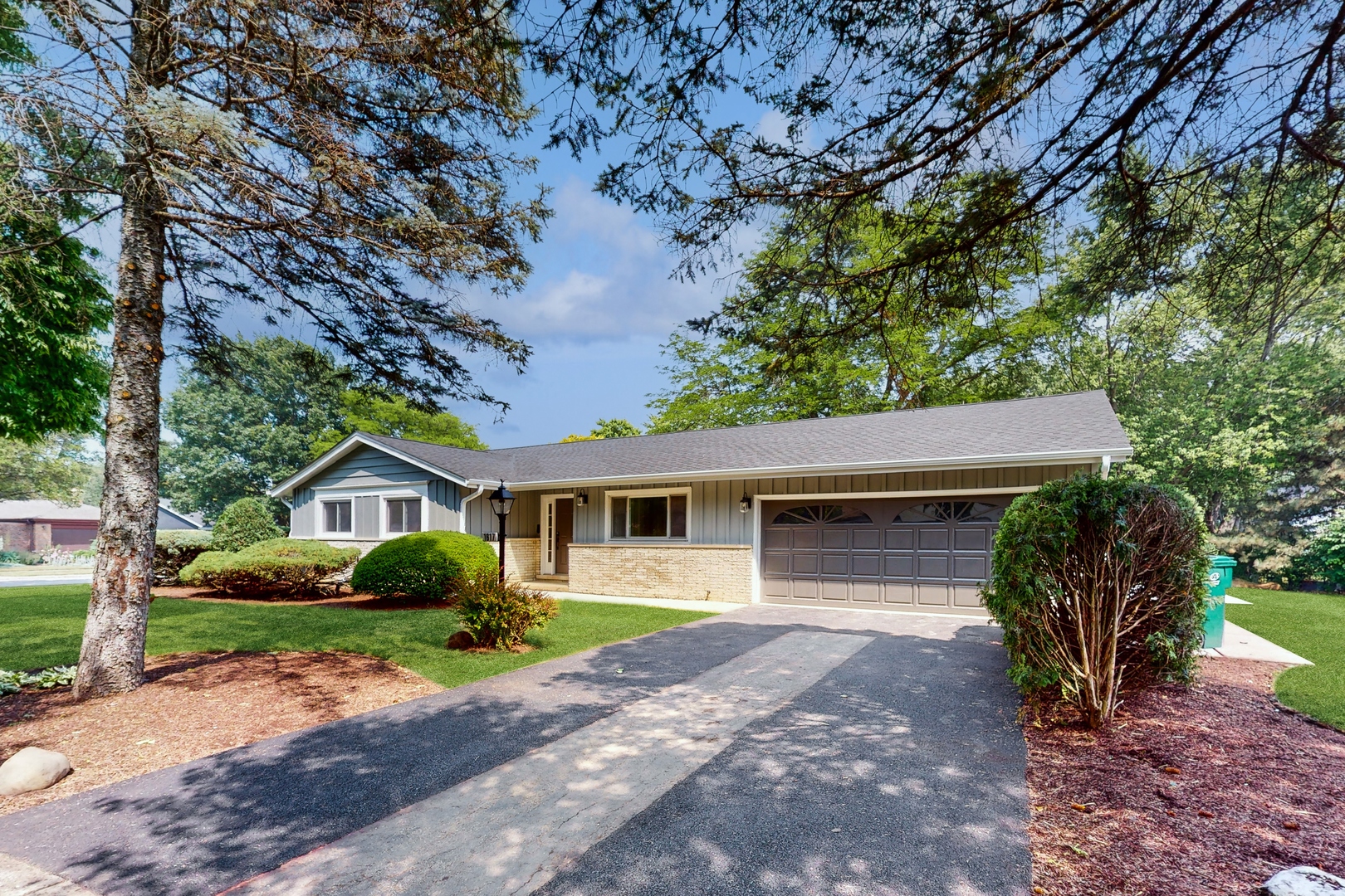 1617 Birch Road Northbrook, IL 60062 - Photo 1 of 32 a front view of a house with garden