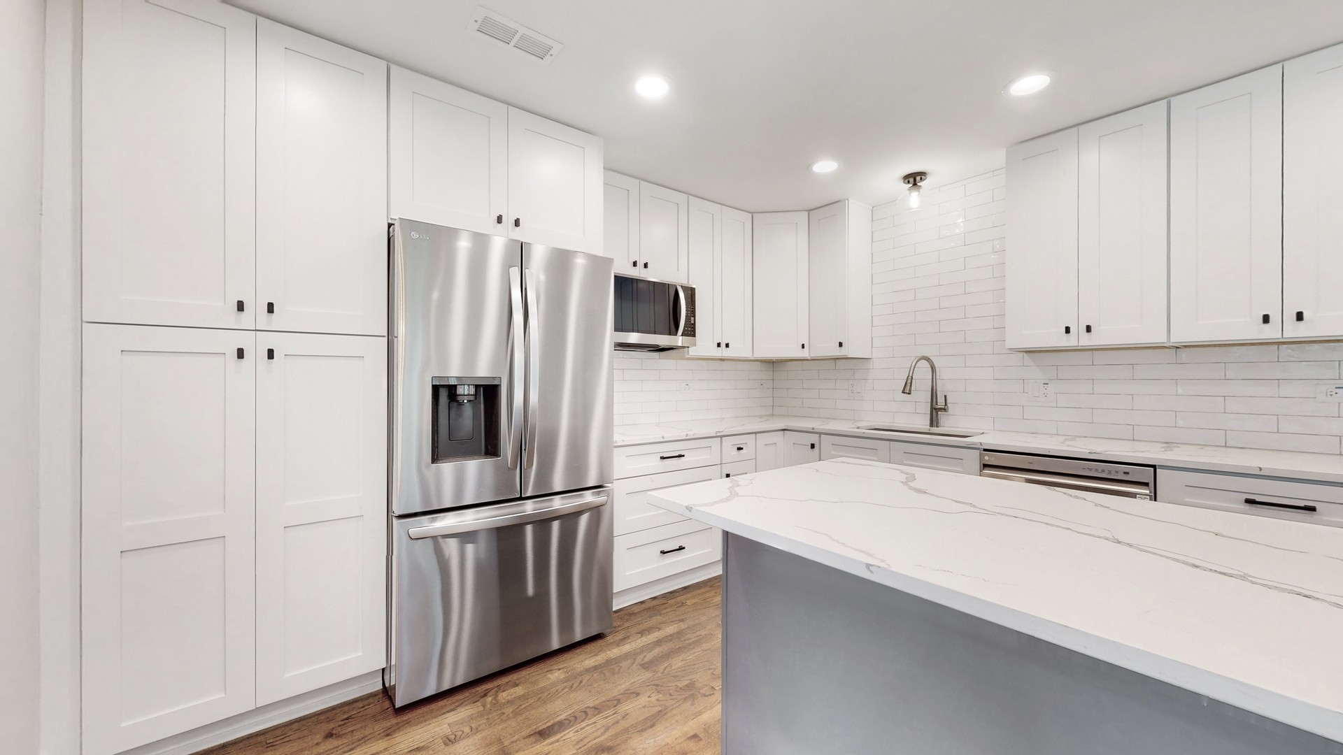 1617 Birch Road Northbrook, IL 60062 - Photo 13 of 32 a kitchen with a refrigerator sink and cabinets